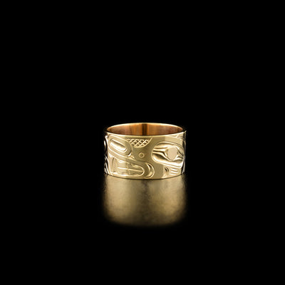 14K Gold 3/8" Bear Ring by Harold Alfred. The design depicts the profile of a bear's head facing the left. The rest of the ring has been delicately hand carved with intricate designs.