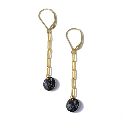 Dazzling lever back earrings handcrafted by artist Debra Nelson. Made of dark grey Swarovski Crystal and 14K gold fill links and hooks. Each earring measures 2" x 0.31" including hook.
