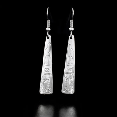 These Long Triangular Orca Earrings are handmade by Coast Salish artist, Gilbert Pat, from sterling silver.  Each earring measures 0.33" x 2.13" from the top of the hook.  The Orca Legend Represents: LONGEVITY, PROTECTION, FAMILY.