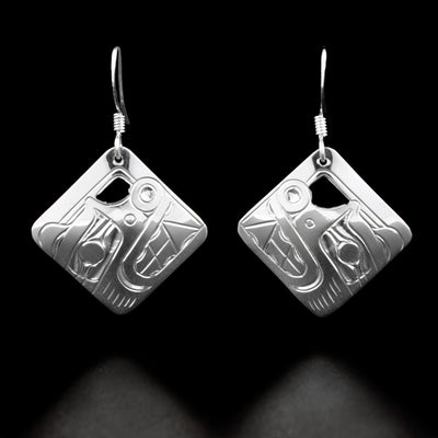 Sterling Silver Square Bear Earrings by Harold Alfred. The design of each earring depicts the head of a bear looking upward with a short, circular snout and teeth.
