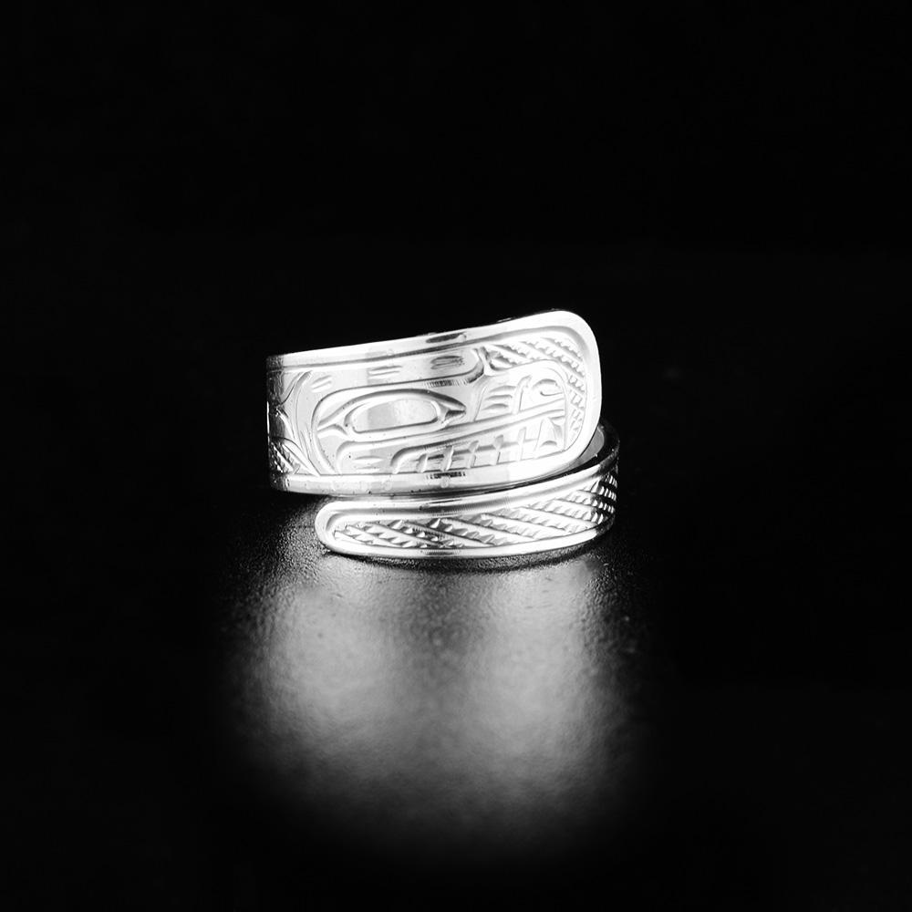 This sterling silver wrap ring has a tapered band that wraps around the finger twice. There is a depiction of the Bear carved into the surface of the band.