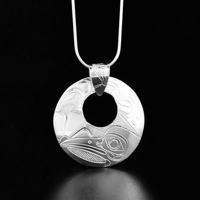 round cut-out sterling silver hummingbird pendant