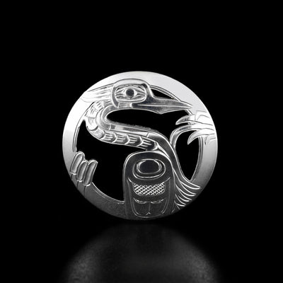 Sterling Silver Heron Pin by Harold Alfred. The design depicts a heron with a large wing and cattails and plants surrounding it.