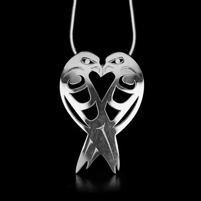 This Sterling Silver Lovebirds Pendant is handmade by Tahltan artist, Grant Pauls.  The pendant measures 1.57" x 1.05". The bail is hidden in the back. The chain is not included.