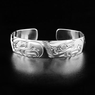 This eagle bracelet depicts the head of four eagles all facing the right carved throughout the bracelet.