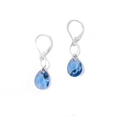 These Teardrop Denim Blue Swarovski Crystal Earrings are hand-crafted by artist Karley Smith. She has used sterling silver and Swarovski Crystal to create them.  Each earring measures 1.38" x 0.38", including the hook.