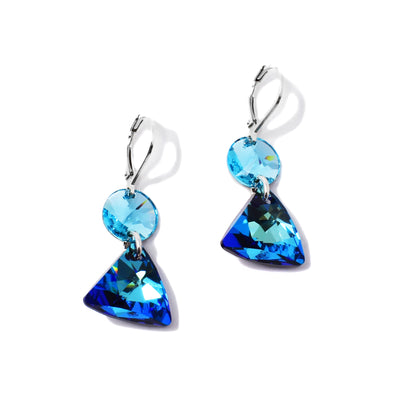 These Delicate Blue Coin and Triangle Earrings are handcrafted by artist Karley Smith. She has used Swarovski Crystal and sterling silver to create them.  Each earring measures 1.50" x 0.63" including the hook.
