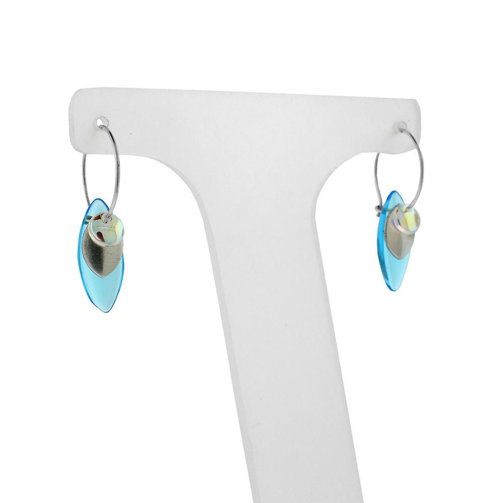 These beaded hoop earrings are made from sterling silver and glass beads. The silver hoops curve below the ear and you can interchangeably add up to three colorful beads to each earring