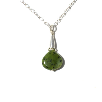 This pendant was made by artist Karley Smith.  The pear-shaped piece of BC Jade is adorned with a silver ring and rests below a silver spacer.  The pendant is 1" (2.5cm) tall and the chain is 20" long.