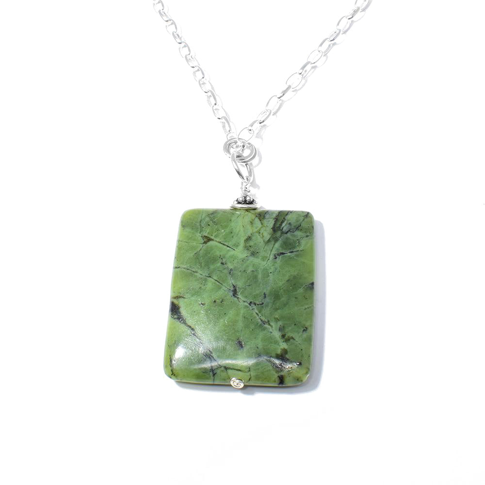 This BC Jade Necklace is by artist Karley Smith. She has used sterling silver and BC jade to create it. The pendant measures 2.25" x 1.19". The 24.5" sterling silver chain is included.