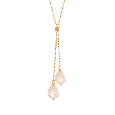 This Gold Fill Pink Pearl Lantern Lariat Necklace is hand crafted by artist Pamela Lauz. The necklace is made using 14k gold-filled chain and genuine pink freshwater pearls.  The necklace is 17" long and the lariat drops down an additional 2.25".