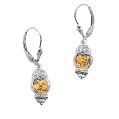     335721  2000 × 2000px  22K Gold Nugget Owl Earrings by Tom Gregorczyk. Each earring was handcrafted to resemble a small owl sitting on a branch looking forward. The artist has put 22k gold nuggets in the belly of each owl.