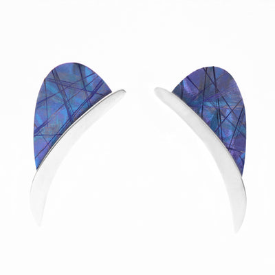 Blue Titanium Eclipse Stud Earrings are handmade by artist Jean-Yves Nantel.