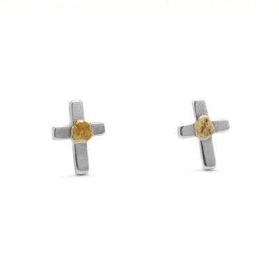 22K Gold Nugget Cross Stud Earrings by Tom Gregorczyk. Each earring has been handcrafted to replicate tiny crosses. The artist has included 22k gold nuggets in the center of each cross where the lines intersect. The remainder of each earring is sterling silver.
