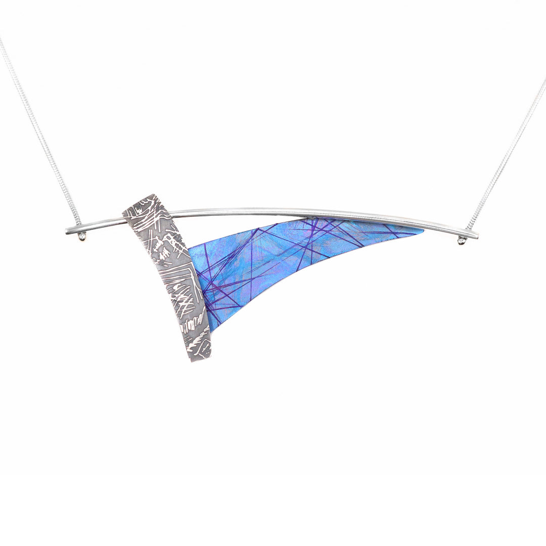 Blue Titanium Embossed Necklace is handmade by artist Jean-Yves Nantel.