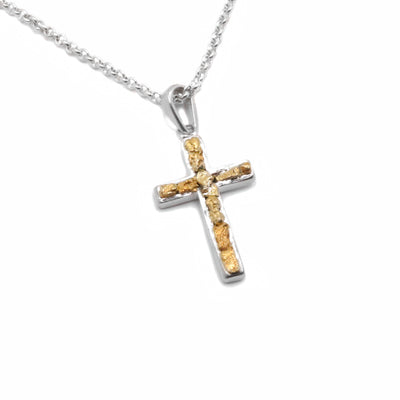 22K Gold Nugget Cross Pendant by Tom Gregorczyk. The pendant is in the shape of a cross with 22k gold nuggets in the center of the cross. The rest of the pendant is made using sterling silver.