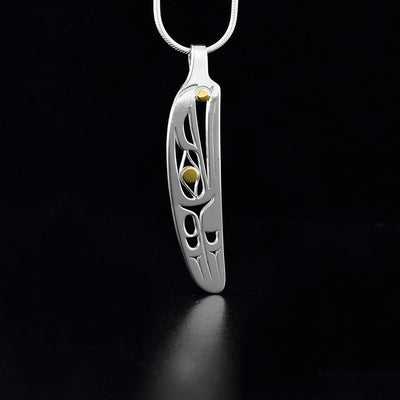 Silver and gold raven pendant