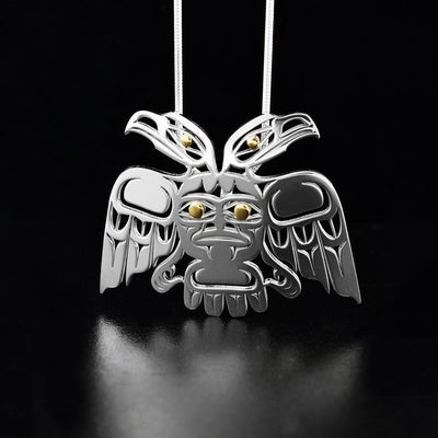 sterling silver and 18K gold pierced Eagle pendant created by Grant Pauls