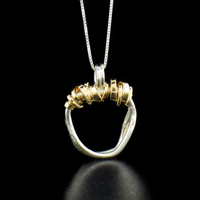 Gold Filled Twist of Fate Necklace handcrafted by artist Joy Annett using sterling silver and 14k gold-filled accents.