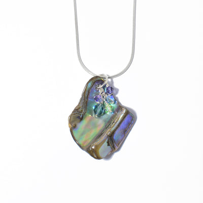 Unique Abalone and Swarovski Crystal Pendant handcrafted by artist Debra Nelson. Made of sterling silver, Swarovski Crystal and abalone. Pendant measures 1.63" x 1.25" including bail. Chain not included.