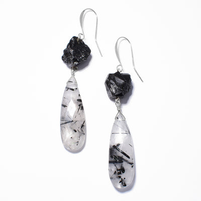 Bold Black Tourmaline and Tourmalinated Quartz Earrings handcrafted by artist Debra Nelson. Made of sterling silver, black tourmaline nuggets and tourmalinated quartz. Each earring measures 2.81" x 0.44" including hook.