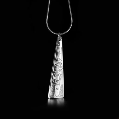 Double-Sided Triangle Hummingbird Pendant hand-carved by Coast Salish artist Gilbert Pat. Made of sterling silver. Pendant measures approximately 2.20" x 0.60" including bail. Chain not included. The Hummingbird Legend Represents: BEAUTY, LOVE, HARMONY.