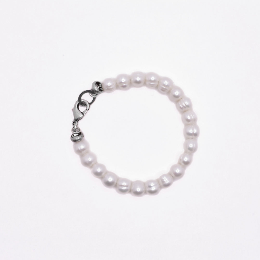 Freshwater Pearl Bracelet handcrafted by artist Karley Smith. Made of oxidized sterling silver and freshwater pearl. Bracelet is 7.5" long.