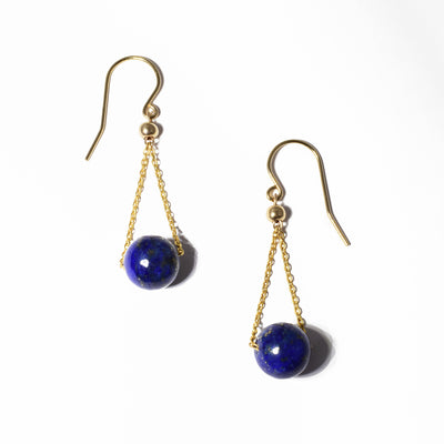 Gold Fill Lapis Lazuli Short Chandelier Earrings handcrafted by artist Pamela Lauz. She has used lapis lazuli and 14K gold-filled wire and chain to create them. Each earring measures 1.5" x 0.4" including the hook.