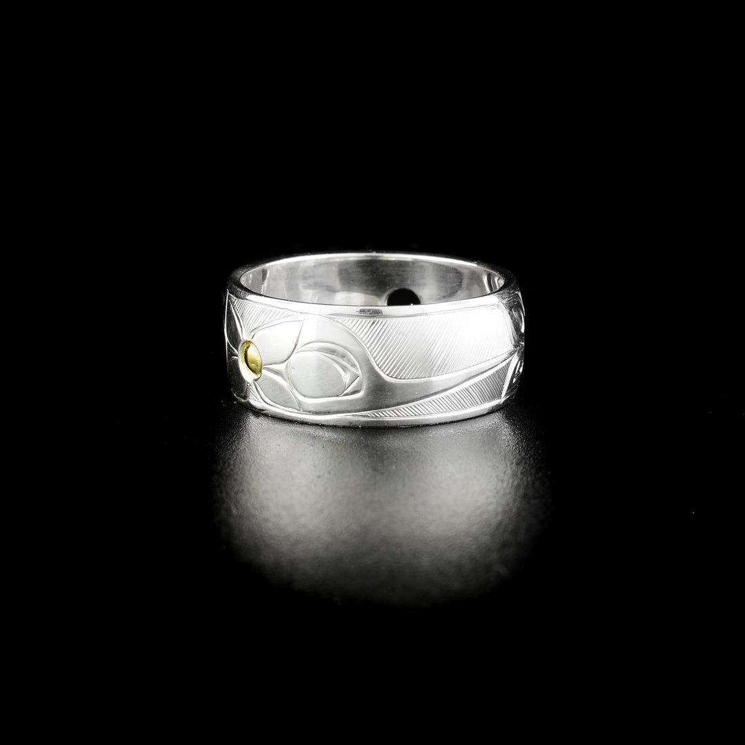 Hummingbird ring pendant hand-carved by Haisla artist Hollie Bartlett. Made of sterling silver and 14K gold. Width of band is 0.38". Can be worn as either ring or pendant. Size 9.