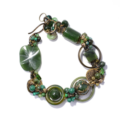 Harmony Jade Bracelet handcrafted by artist Honica. Made of handworked brass, chrome diopside, chrysocolla, aventurine, horn, BC jade and malachite. 9.25" long and 0.95" at its widest, will comfortably fit a 6.25" to 6.50" wrist.