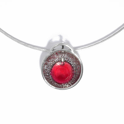 Pendant is drop of hot pink resin in silver bowl, letter-stamped inside. Pendant catches ambient light, giving resin a vibrant glow, which imparts colour onto letter-stamped silver. Adjustable 16” to 18” sterling silver chain included.