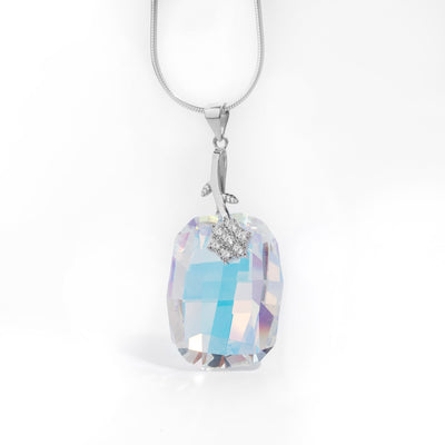 Large Graphic Aurora Borealis Pendant with Cubic Zirconia Flower handcrafted by artist Debra Nelson. Made of sterling silver, Aurora Borealis Swarovski Crystal and cubic zirconia. Pendant measures 2" x 0.83" including bail. Chain is not included.