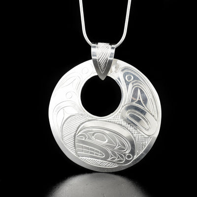 Dazzling cut out orca pendant hand-carved by Kwakwaka'wakw artist Don Lancaster. Made of sterling silver. Pendant measures 1.75" x 1.5" including bail. Chain not included.