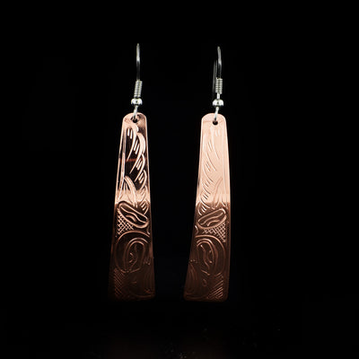Long Copper Eagle Earrings hand-carved by Kwakwaka'wakw artist John Lancaster. They are made of copper and have sterling silver ear hooks. Each earring measures 2.63" x 0.50" including hook.