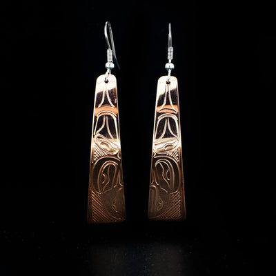 Long Copper Raven Earrings hand-carved by Kwakwaka'wakw artist John Lancaster. They are made of copper and have sterling silver ear hooks. Each earring measures 2.65" x 0.50" including hook.