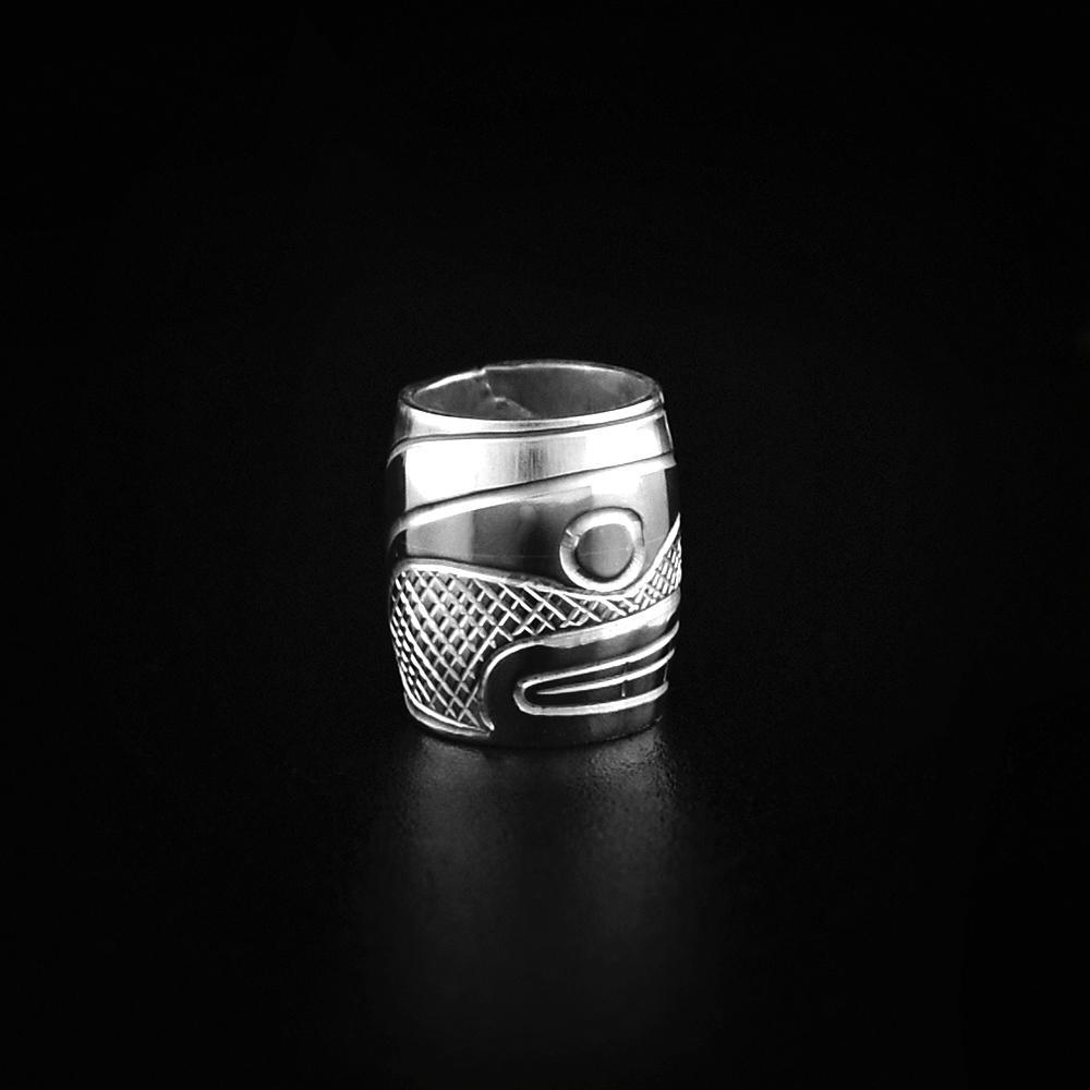 This Orca whale charm is made from sterling silver and is longer than is it wide. There is a depiction of the Orca carved into the surface of the bead.