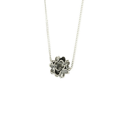 Delicate Oxidized Sterling Silver Clover Cluster Necklace handcrafted by artist Dushka Vujovic. Cluster is made from oxidized sterling silver. Silver chain link necklace included. Cluster measures 0.31" x 0.38" and chain is 16" long.