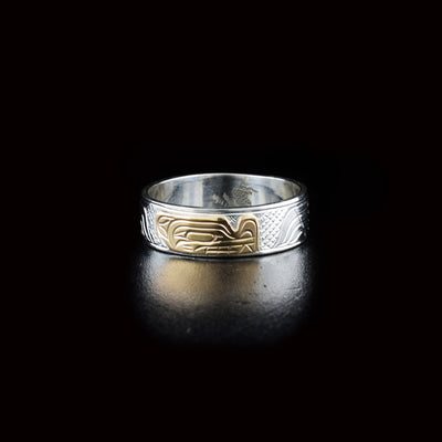 Stunning wolf ring hand-carved by Kwakwaka'wakw artist Victoria Harper. Made of 14K gold and sterling silver. Width of band is 0.25".