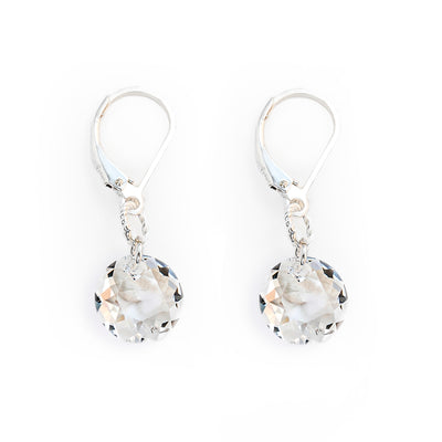 Delicate lever back earrings handcrafted by artist Debra Nelson. Made of Swarovski Crystal and sterling silver. Each earring measures 1.25" x 0.38" including hook.