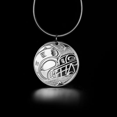 Detailed round bear pendant hand-carved by Kwakwaka'wakw artist Victoria Harper. Made of sterling silver. Pendant measures 1.15" x 1" including bail. Chain not included.