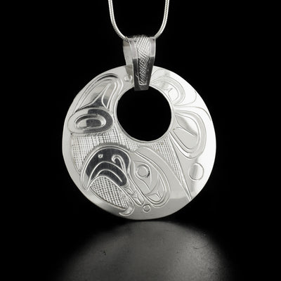 Silver Eagle Cut Out Pendant with Carved Bail hand-carved by Kwakwaka'wakw artist Don Lancaster. Made of sterling silver. Pendant measures 2.15" x 1.95" including bail. Chain not included.