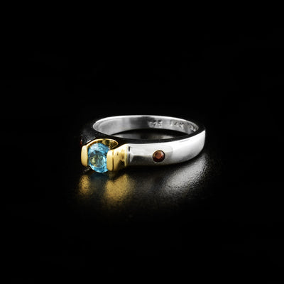 Silver and Gold Blue Topaz Ring with Garnets