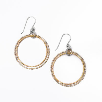 Double hoop dangle earrings by Iris Rogers Melamed. Made of sterling silver and gold fill. Each earring measures 2" x 1.31" including hook.