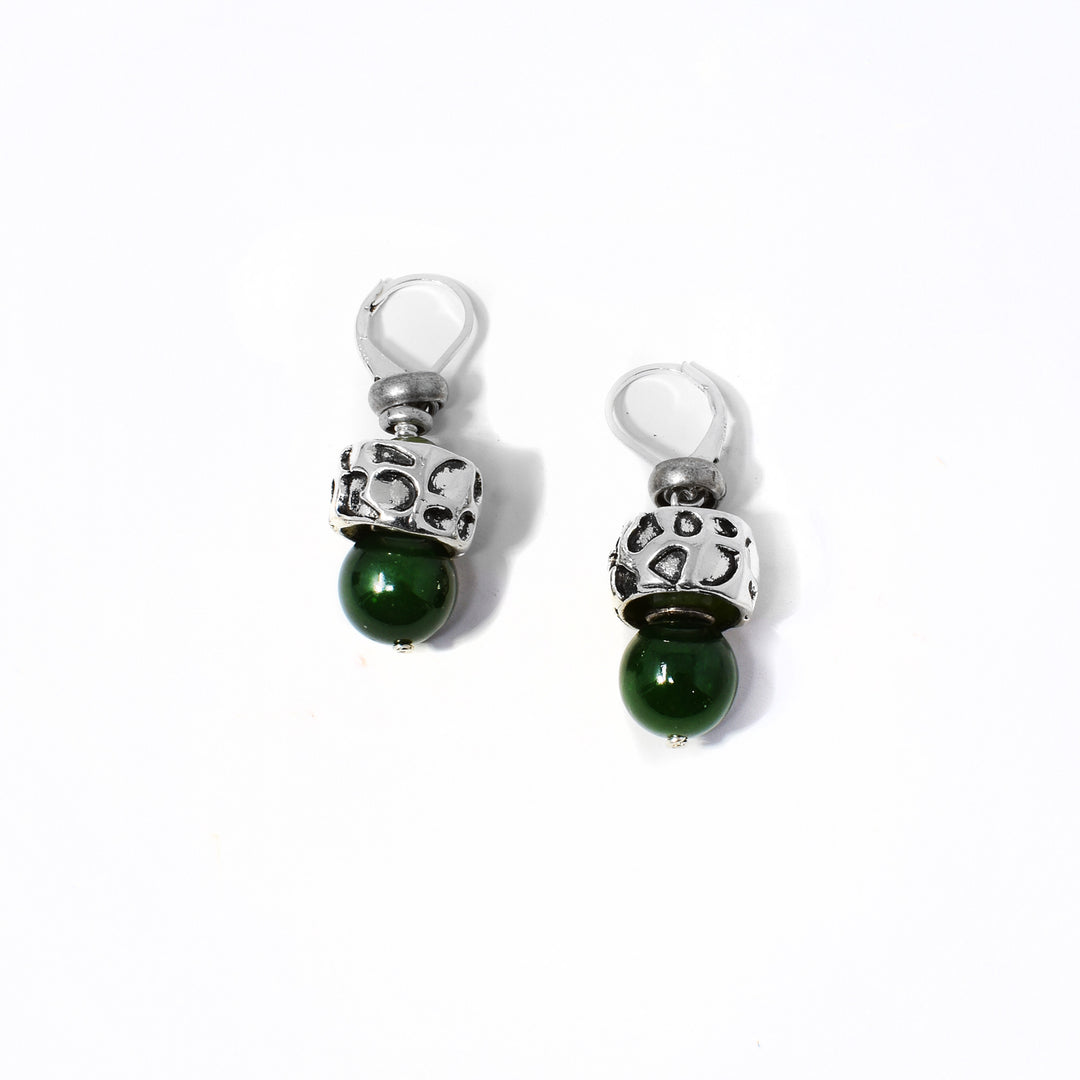 Delicate lever back earrings handcrafted by artist Karley Smith. Made of sterling silver, antique silver and BC jade. Each earring measures 1.38" x 0.50" including hook.