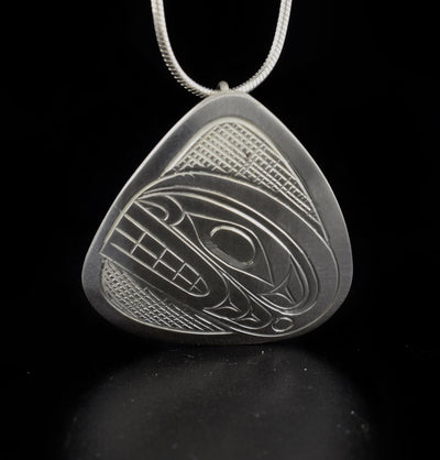 Silver Triangle Orca Head Pendant hand-carved by Kwakwaka'wakw artist Don Lancaster. Made of sterling silver. Pendant measures 1.20" x 1.35". Hidden bail on back. Chain not included.
