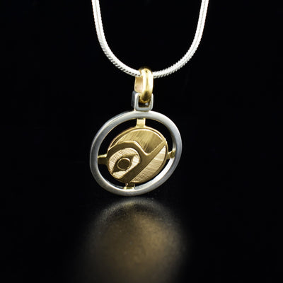 Sterling silver and 14K gold hummingbird rail pendant hand-carved by Haisla artist Hollie Bartlett. Pendant measures 1.13" x 0.88" including bail. Chain not included.