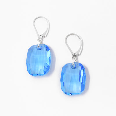 Stunning lever-back Aqua Swarovski Crystal Earrings handcrafted by artist Debra Nelson. Made of sterling silver and Swarovski Crystal. Each earring measures 1.50" x 0.56" including hook.