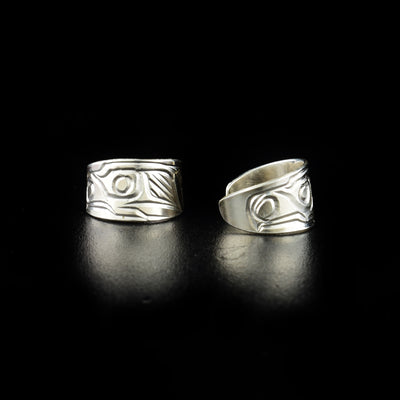 Dainty eagle ear cuffs hand-carved by Heiltsuk artist Ivan Wilson. Made of sterling silver. Each cuff is 0.31" at its widest.