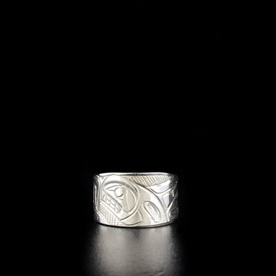 Stunning orca ring hand-carved by Kwakwaka'wakw artist Norman Seaweed. Made of sterling silver. Ring has width of 0.5" and tapers down in back. Size 9.5.