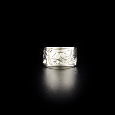 Tapered raven ring hand-carved by Coast Salish and Cree artist Richard Lang. Made of sterling silver. Ring is 0.50" in the front and tapers down to 0.25" in the back. Size 9.5.